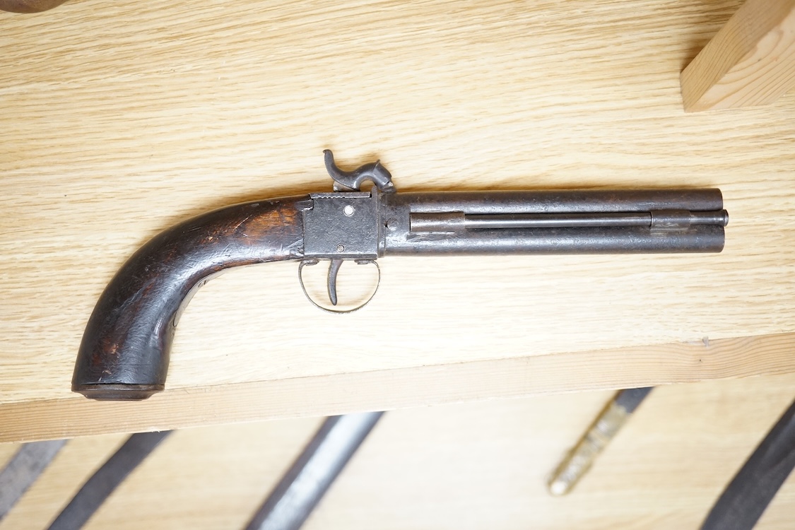 A boxlock percussion pocket pistol with Damascus twist turn off barrel, liege proofs, rounded wooden grip replaced, together with an ‘over and under’ boxlock percussion pistol